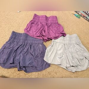 Set of Three Women's Athletic Shorts in Purple, Pink, and Silver free people